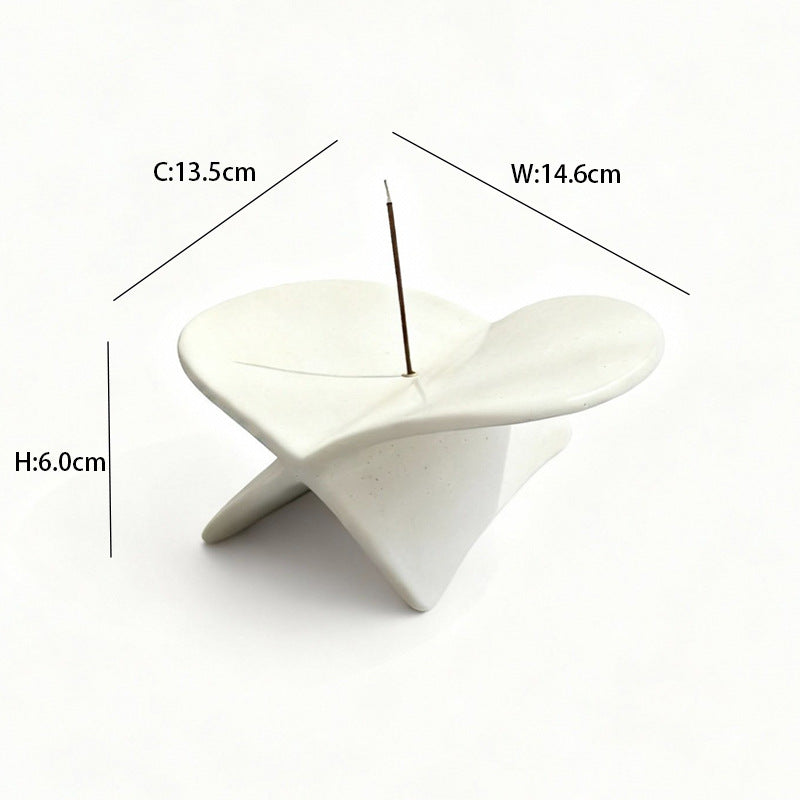 White airplane ceramic incense holder styled with books