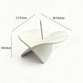 White airplane ceramic incense holder styled with books